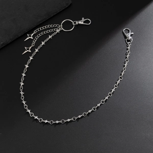 Detail of punk silver metal wallet chain with star pendants and double lobster clasps