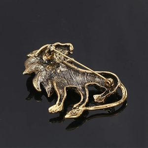 Vintage lion brooch back view in antique gold with pin and clasp mechanism details