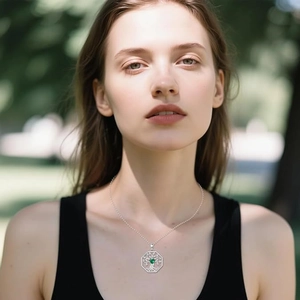 Detail view of Irish Celtic Tree of Life necklace worn by model in outdoor natural light
