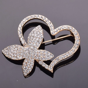 Elegant gold heart and butterfly brooch with sparkling crystals and a safe pin closure