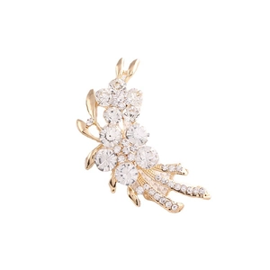 Broche fleur dorée élégante avec des cristaux étincelants pour tenue de mariée chic