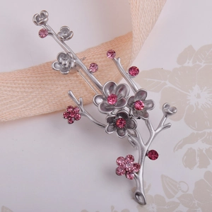 Elegant silver plum blossom branch brooch with pink rhinestones in traditional Chinese style