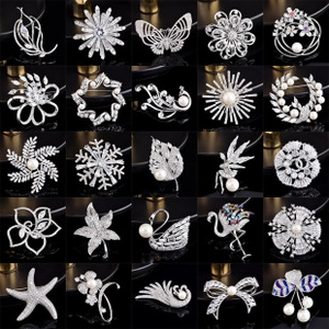 Detailed collection of 25 silver alloy brooches with sparkling zircon and pearl accents