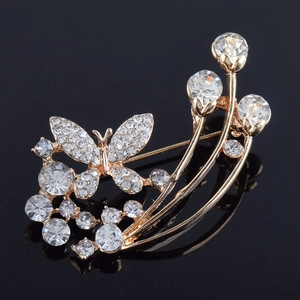 Elegante spilla a farfalla dorata con cristalli di zircone e strass scintillanti