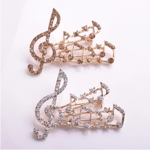 Broche élégante en forme de note de musique avec strass scintillants en or rose et argent