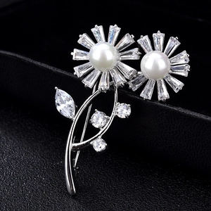 Exquisite silver flower brooch with white faux pearls and cubic zirconia on black box