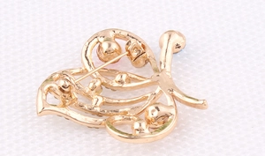 Detail view of the colorful butterfly brooch back with a secure metal pin clasp