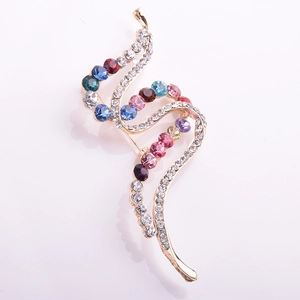 Elegant S-shaped gold brooch featuring colorful rhinestones and sparkling crystal accents