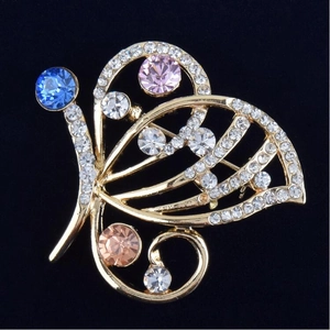 Exquisite colorful butterfly brooch pin with sparkling rhinestones on elegant black background