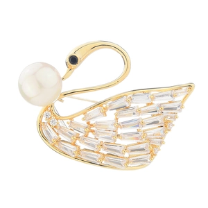 Elegant gold swan brooch featuring white pearl and baguette-cut cubic zirconia accents