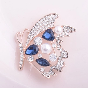 Broche papillon élégante or rose avec cristaux bleus et perles pour femmes