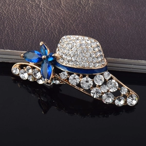 Elegant gold hat brooch with crystal rhinestones and blue gemstone flower accents