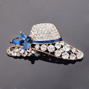 Fashionable crystal hat brooch with gold metal base and blue enamel stripes in high quality