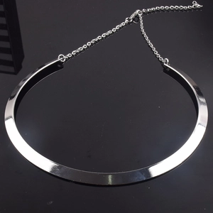 Polished silver metal choker necklace with adjustable lobster clasp on black background