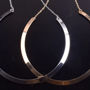 Detailed view of punk metal collars in silver, gold, and rose gold finishes