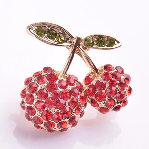 Elegant cherry brooch with red crystals and green rhinestones on gold alloy base