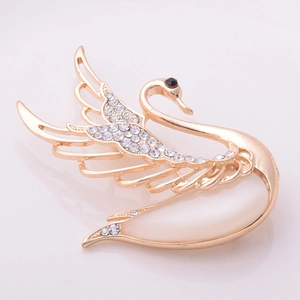 Elegant golden swan brooch featuring opal stone body and sparkling crystal wings decor