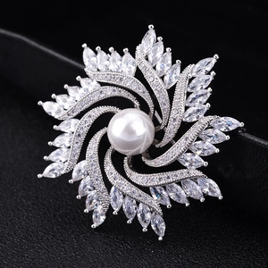 Luxurious crystal windmill brooch with white pearl and sparkling zircon stones