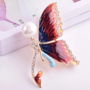 Elegant mermaid butterfly brooch with blue enamel wings and a large pearl accent