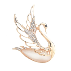 Elegant gold swan brooch with white rhinestones and a large opal effect gemstone inlay