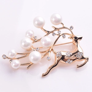 Detail of reindeer brooch with gold alloy, white pearls, and sparkling rhinestones