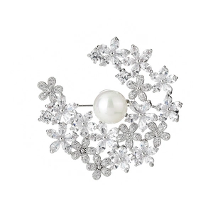 Elegant crescent moon flower brooch with sparkling rhinestones and a large white pearl