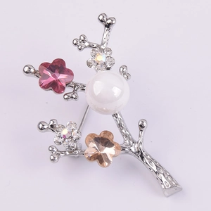 Elegant floral branch brooch with large white pearl and pink crystal flowers on silver base