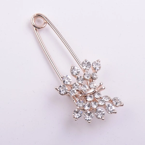 Elegant rose gold butterfly brooch with sparkling rhinestones on a safety pin base