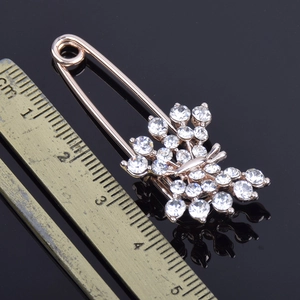 Sparkling butterfly rhinestone brooch in rose gold with large safety pin design