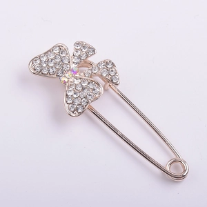 Elegant gold butterfly safety pin brooch with sparkling white and colorful rhinestones