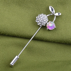 Close-up of cherry brooch with silver plating, white crystals and AB rhinestones