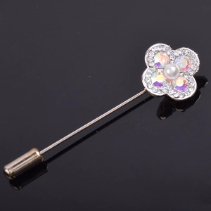 Elegant silver four-leaf clover brooch with iridescent rhinestones and a white pearl