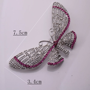 Detailed view showing the butterfly brooch dimensions at 7.5cm by 3.4cm with rhinestones