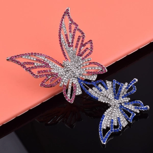 Broche papillon élégante en strass bleu et magenta avec design ajouré pour accessoires