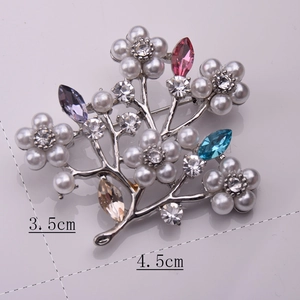 Macro detail of luxury rhinestone and pearl flower brooch with multicolor gemstones