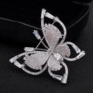 Luxury butterfly brooch with sparkling zircon crystals on elegant black background