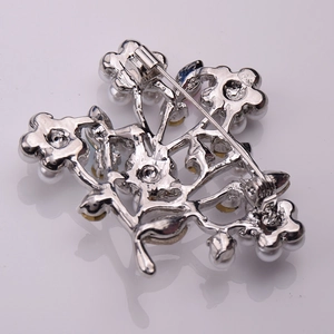 Detailed back view of silver tree brooch with secure pin clasp and sturdy construction