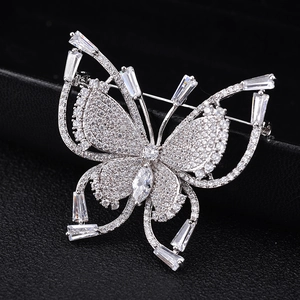 Luxurious butterfly brooch with cubic zirconia crystals in silver metal for evening gala
