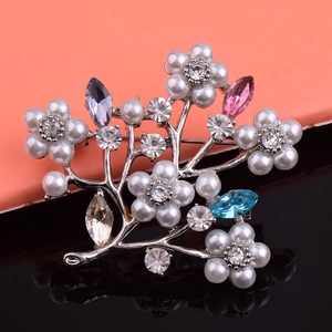 Elegant silver flower branch brooch with pearls and colorful crystals on mirror base