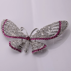 Elegant butterfly brooch in silver alloy with vibrant pink and white sparkling crystals