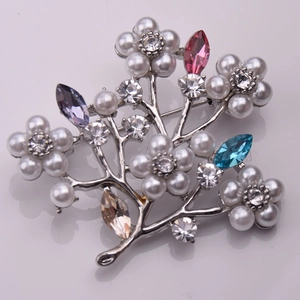 Detailed view of the multi-color crystal and pearl flower tree brooch with silver plating