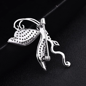 Silver butterfly brooch with micro-p镶 zircon stones shown from a back-side perspective