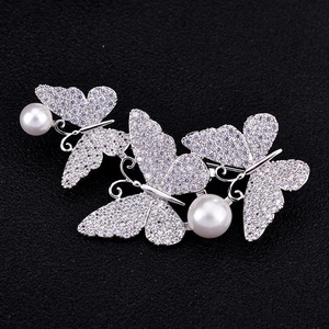 Elegant silver butterfly brooch with sparkling cubic zirconia stones and white pearls