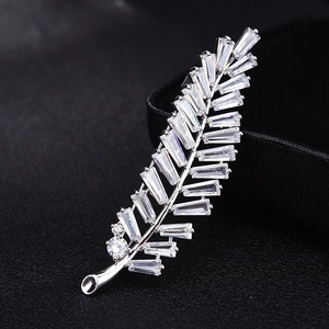 Silver feather brooch with micro-pave rectangular cubic zirconia in natural curve shape
