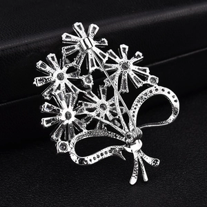 Elegant silver flower bouquet brooch featuring clear zircons and secure pin clasp detail
