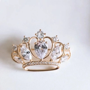 Exquisite gold crown brooch with micro-paved AAA zircons and a pear-cut center stone