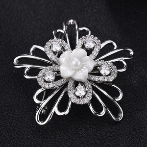 Elegant silver shell flower brooch with AAA zircon petals and a central pearl detail