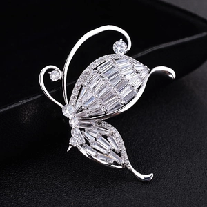 Elegant silver butterfly brooch with micro-pave baguette and round cubic zirconia