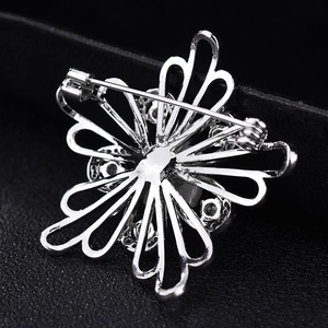Elegant shell flower brooch with AAA zircon and white pearl on black leather background