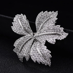 Elegant maple leaf brooch with silver plating and sparkling cubic zirconia stones